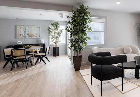 A modern living room with a black and white color scheme.