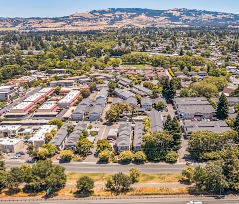 A suburban area with a mix of houses and trees.