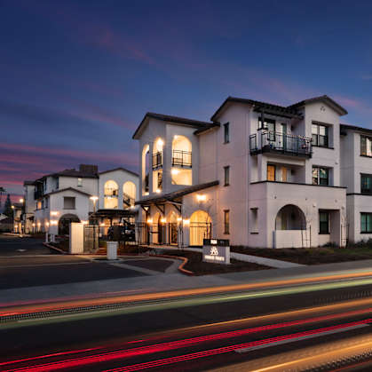 A long exposure shot of a building with a street in front of it.
