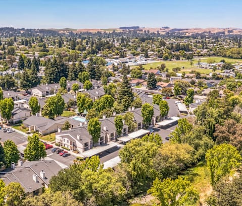 A suburban neighborhood with houses and trees.