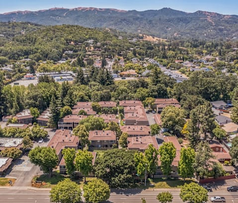 A bird's eye view of a residential area with houses and trees.