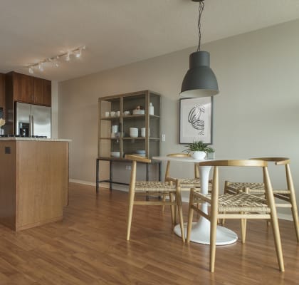 Kitchen and dining room with hardwood floors at Optima Old Orchard Woods, Skokie, IL, 60077