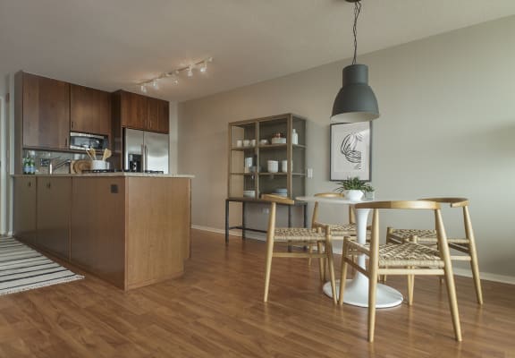 kitchen and dining room with hardwood floors at Optima Old Orchard Woods, Skokie, IL, 60077
