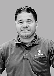 a man wearing a shirt and tie posing for a picture