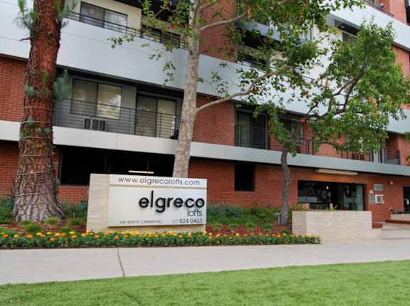 A sign for Elgreco lofts is in front of a building at El Greco Lofts, Los Angeles, CA