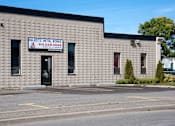 Thumbnail 2 of 6 - A building with a sign that says "Marist Metal Works" and a phone number.