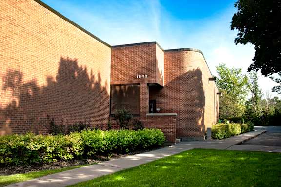 A brick building with the number 1840 on it.
