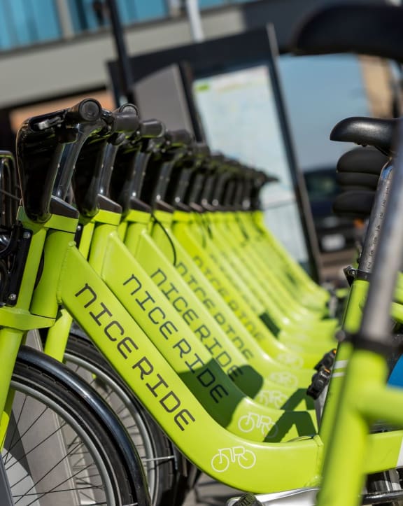 A row of yellow bikes for residents to use at Edition Apartments. 