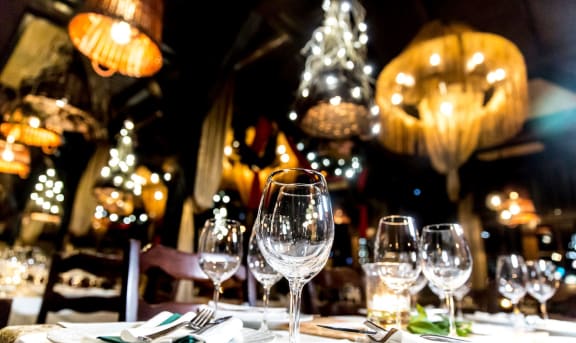 a table at a restaurant with wine glasses