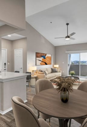 an open living room and dining room with a table and chairs at Stonelake at the Arboretum, Austin