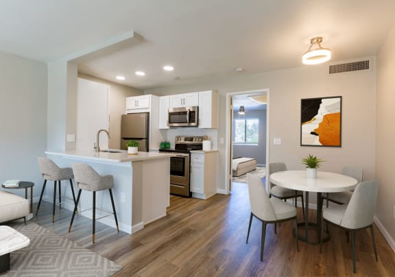 a living room and kitchen with a table and chairs at Promontory, Arizona