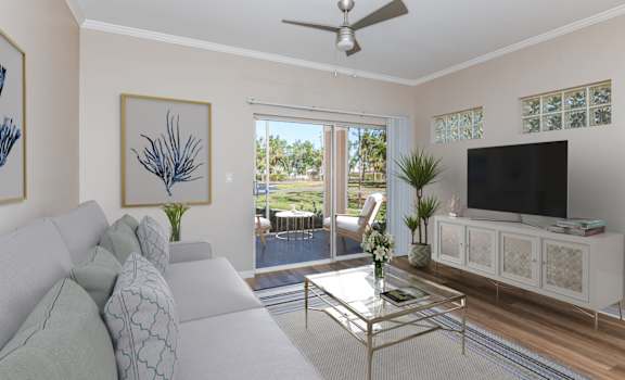 a living room with a couch and a coffee table at Bay Breeze Villas, Fort Myers, Florida