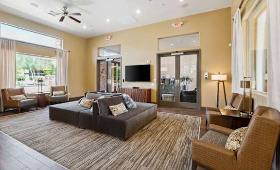 a living room with a couch and a tv at Pima Canyon, Arizona, 85704