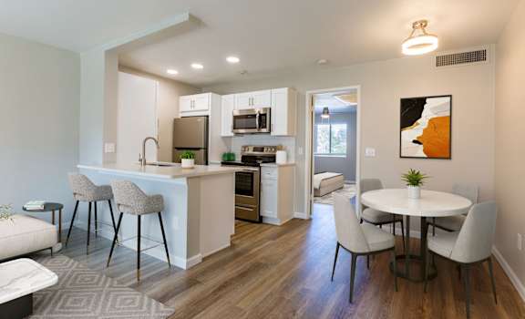 a living room and kitchen with a table and chairs at Promontory, Tucson, Arizona