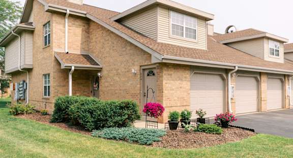 a house with a garage and a lawn