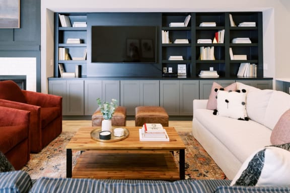 a living room filled with furniture and a flat screen tv