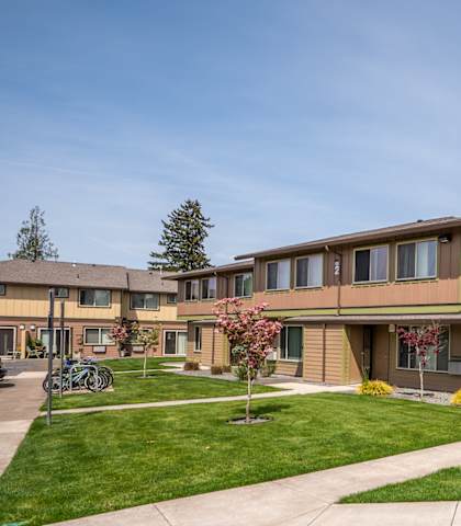 A residential area with houses and a clear sky.