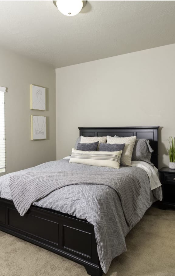a bedroom with a large bed and two night stands