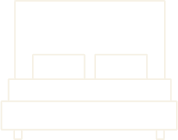 A black and white image of a bed with two pillows.