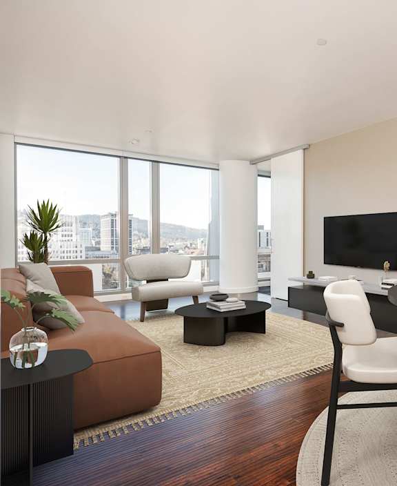 A modern living room with a brown sofa, a black coffee table, and a flat screen TV.