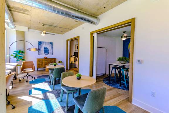 A room with a table and chairs.