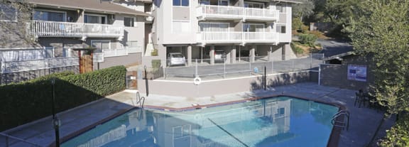 a house with a large pool in front of it