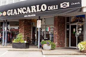 A storefront with a sign that says Giancarlo Deli.