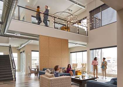 A group of people are standing in living room.