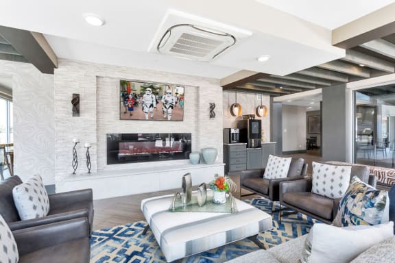 Westwood Green Apartments Clubhouse Lounge with couches, fireplace and tv