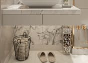 Thumbnail 1 of 2 - a bathroom with marble walls and a sink and a mirror