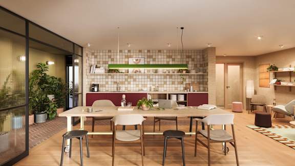 A modern dining area with a glass wall and a long table with chairs.