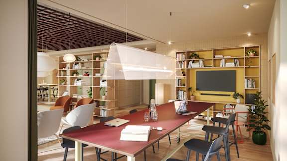 A modern dining room with a long table and chairs.