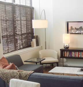 Living room with wood floors and television at Star Mill Lofts Apartments, Middleboro, MA 02370