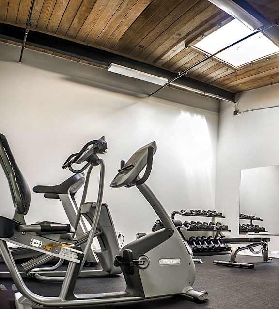 Fitness center with cardio and weight equipment at Star Mill Lofts Apartments, Middleboro, MA