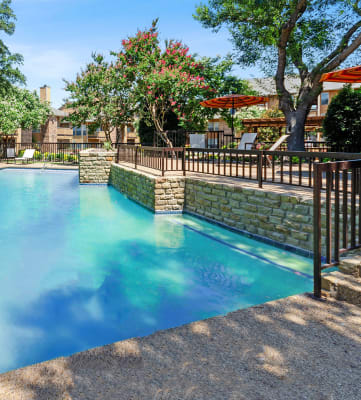 Swimming pool at Bridges at Deer Run Apartments in Dallas, TX.