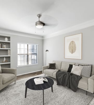 Model living room at Bridges at Oakbend Apartments in Lewisville, TX.