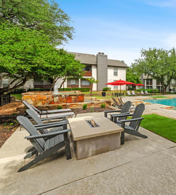 Community fire pit and swimming pool at Autumnwood Apartment Homes, in Arlington TX.