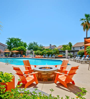 Fire pit and swimming pool at Lore South Mountain apartments in Ahwatukee, AZ