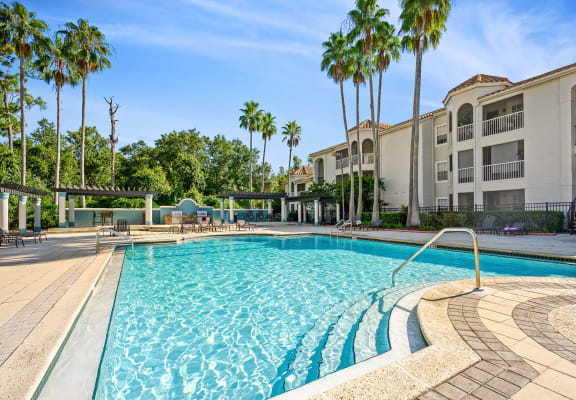 Pool & sundeck at The Vinings At Hunter's Green Apartments in Tampa, FL.