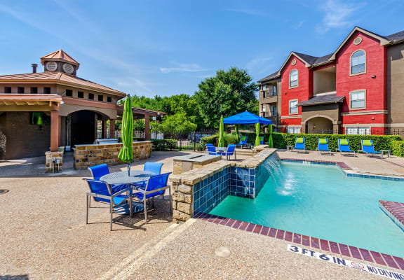 Community pool at Hidden Creek apartments in Lewisville, TX.