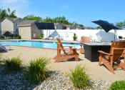 Thumbnail 4 of 22 - Outdoor pool and fire pit with seating for four