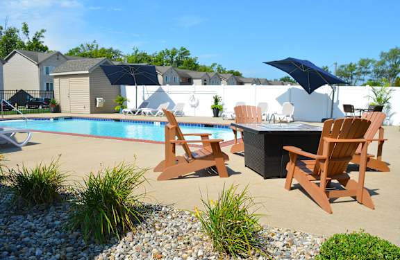 Outdoor pool and fire pit with seating for four