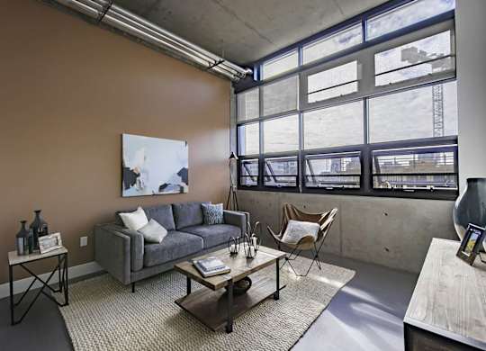 Model Concrete Living Room at Idea1 Apartments in San Diego CA