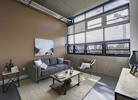Model Concrete Living Room at Idea1 Apartments in San Diego CA