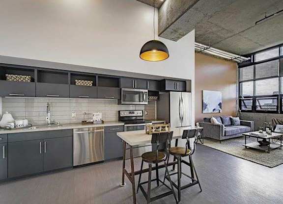Model Concrete Kitchen and Living Room at Idea1 Apartments in San Diego CA