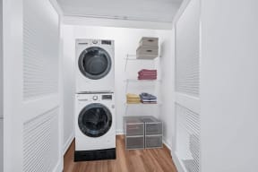 a small laundry room with a washing machine and a dryer