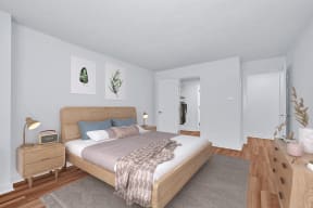 a bedroom with a bed and a dresser