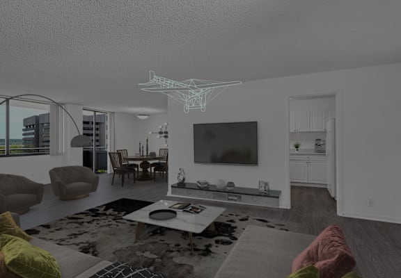 a view of a living room and a dining room with a television