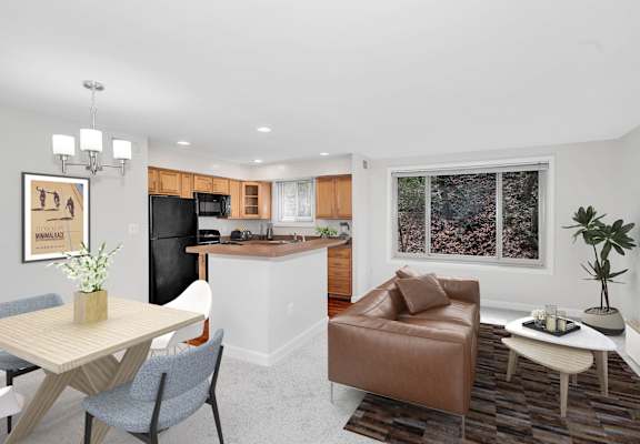 a living room and kitchen in a 555 waverly unit