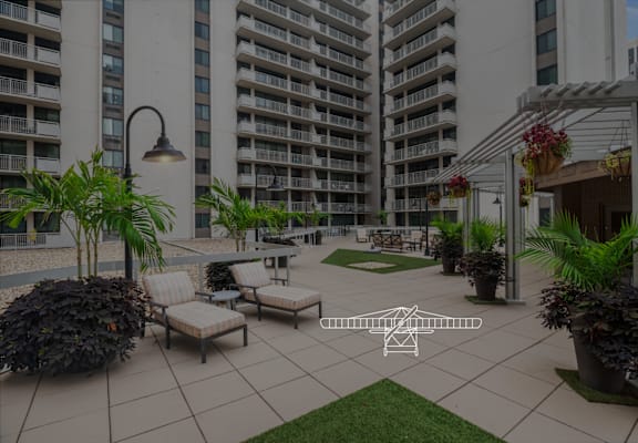 a rendering of a patio with chairs and plants in front of an apartment building